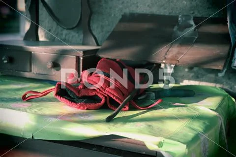 A red work gloves and limpid icicle Stock Photos