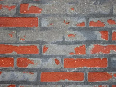 Red Worn Repaired Brickwall Background with Uneven Mortar Stock Photos