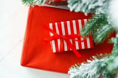 Red wrapped gift boxes, presents under festive Christmas tree with lights a.. Stock Photos