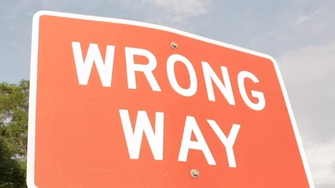 Red wrong way danger warning sign post Stock-Footage 98632005