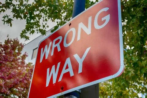Red wrong way sign on a post Stock Photos