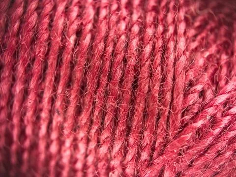 Red yarn thread texture close up macro concept for knitting, textile industry, 库存照片