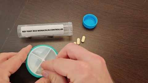 RED YEAST RICE MONACOLIN-CONTROLLED herbal botanical supplement for cholesterol Stock Footage 346727913