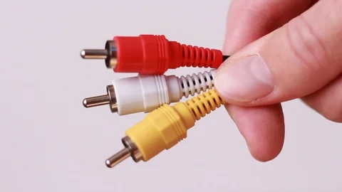 Red yellow and white computer pluging cables in hand 스톡 동영상 88245124