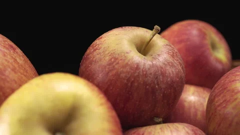Red-yellow apples close-up on a black background Vídeos de archivo 137240034