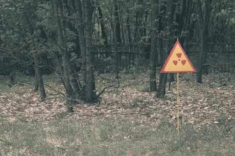 Red-yellow radiation sign on a lawn. Exclusion Zone. Chernobyl, Pripyat Stock Photos