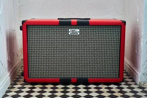 A red Zilla guitar cab. Stock Photos
