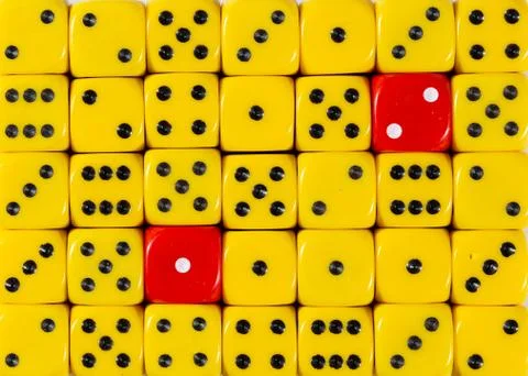 RedBackground of random ordered yellow dices with two red cubes Stock Photos