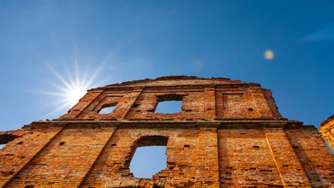 Redbrick old medieval castle wall on a sunny sky background Video stock 136730937
