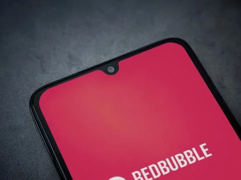 Redbubble app launch screen on smartphone on dark marble stone background Stock Photos