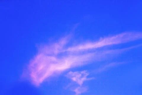 Reddish blue sky with small cloud Stock Photos