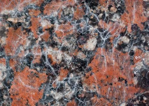 Reddish-brown granite texture with black and gray spots.Used as a background. Stock Photos