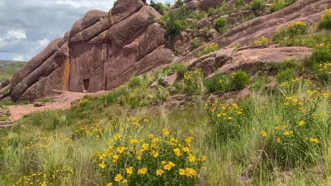 Reddish rock formations in Aramu Muru near Puno in Peru Stock Footage 308615685