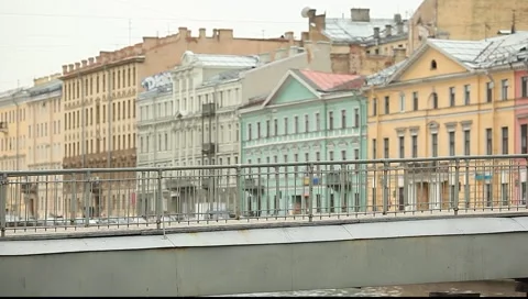 Рedestrian walking on the small pedestrian bridge, against architecture Stock Footage 5163588