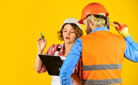 Redevelopment of home. Couple look documents. Control process. Renovation 库存照片