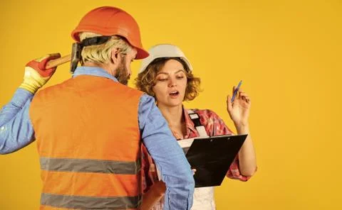 Redevelopment of home. Couple look documents. Control process. Renovation 库存照片
