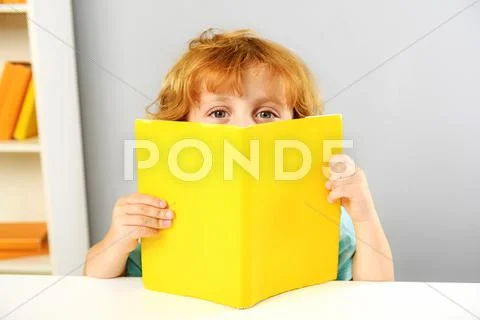Redhead boy at lesson indoors Stock Photos