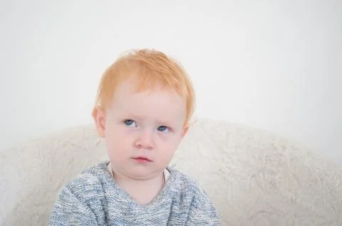 Redhead boy is thinking Stock Photos