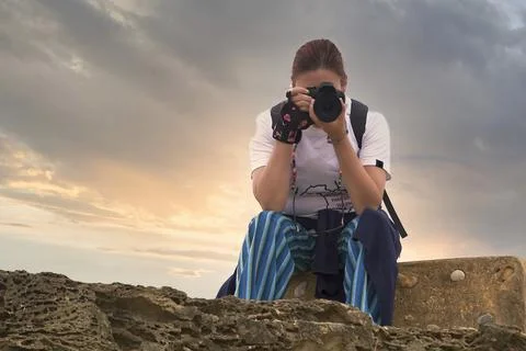 Redhead with camera and backpack Foto stock