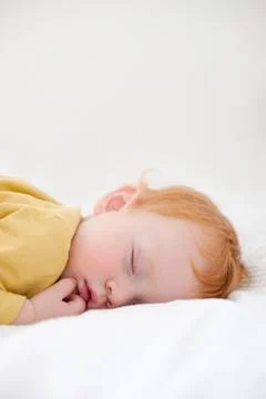 Redhead child is sleeping Stock Photos