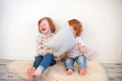Redhead children throw pillows Stock Photos