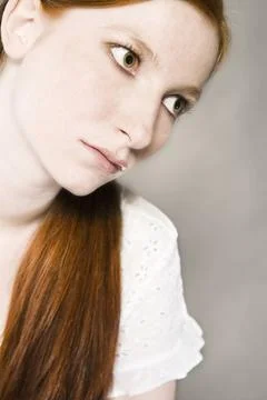 Redhead with great lips Studio portrait of a natural redhead with lipgloss... Stock Photos