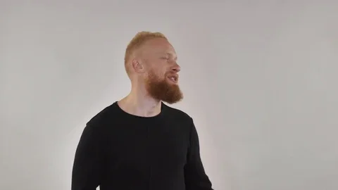 Redhead guy having fun, dancing in front of camera Stock Footage 81771119