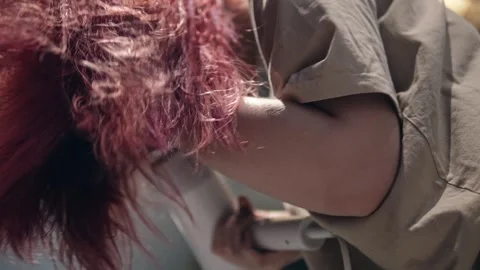 Redhead lady is drying her hair with hairdryer standing in the bathroom with Stock-Footage 343902802