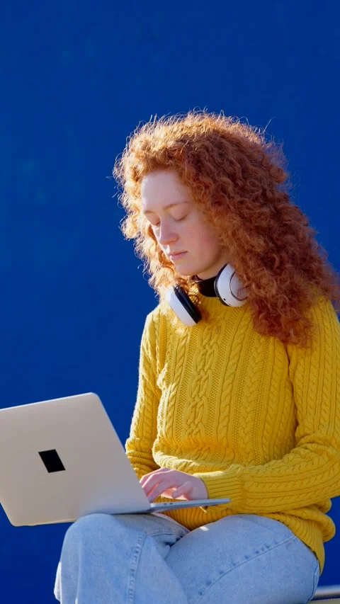 Redhead student working on laptop Stock Footage 272806079