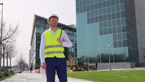 Redheaded Construction Worker Holding Hard Hat at Construction Site Stock Footage 278645110