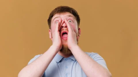 Redheaded guy screams with excitement while Stock Footage 234690056