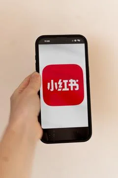 RedNote app displayed on a smartphone held in hand Stock Photos