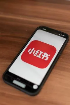 RedNote app logo displayed on smartphone screen Stock Photos