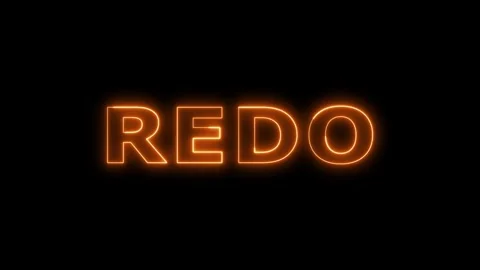 Redo text glowing orange neon effect on black. 库存影片 332533623