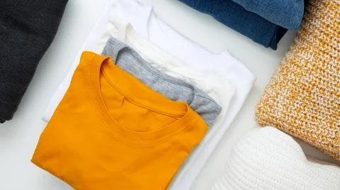 Reduce and reuse concept. Preparing clothes for swap. Waste problem in fashio Stock Photos