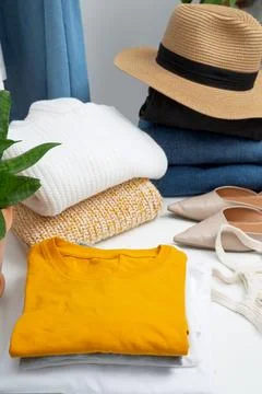 Reduce and reuse concept. Preparing clothes for swap. Waste problem in fashio Stock Photos