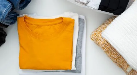 Reduce and reuse concept. Preparing clothes for swap. Waste problem in fashio Stock Photos