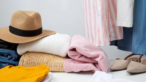 Reduce and reuse concept. Preparing clothes for swap. Waste problem in fashio Stock Photos