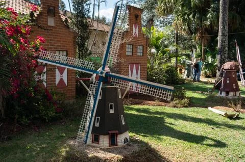 Reduced scale dutch windmills inside a garden near Holambra Historical Museum Stock Photos