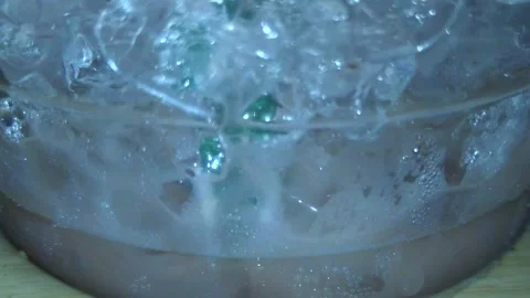 Reducing the amount of water placed in a glass wit1 Stock Footage 252804508