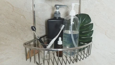 Reducing visual clutter. Bathroom corner shelf organizing hygiene products, Video stock 338390139