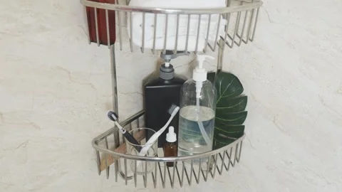 Reducing visual clutter. Bathroom shower caddy with toiletries, personal care Video stock 338390664