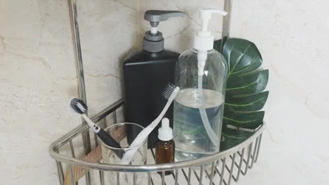 Reducing visual clutter. Bathroom shower caddy holding hygiene products and Video stock 338391046