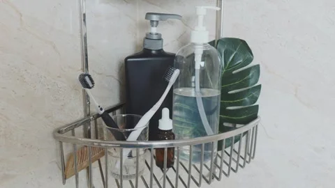 Reducing visual clutter. Bathroom toiletries and personal hygiene products Video stock 338390404