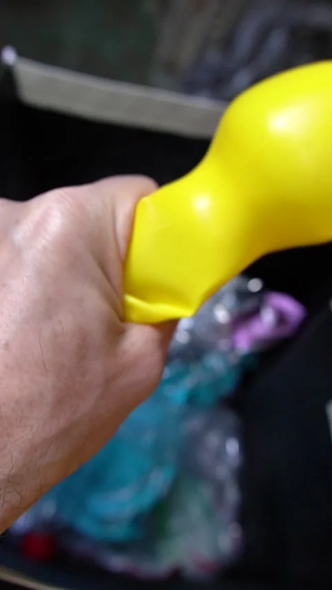 Reducing Waste: Hand Squeezing Bottle in a Dark Garbage Can Video stock 320151171