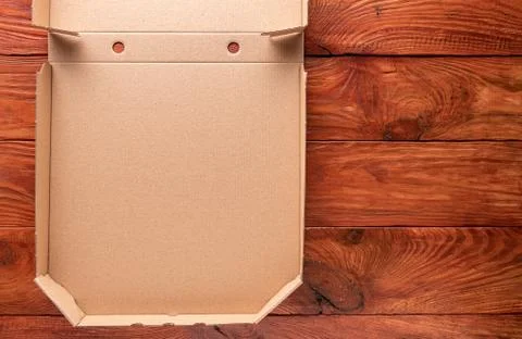 Redwood background with part of empty pizza box Stock Photos