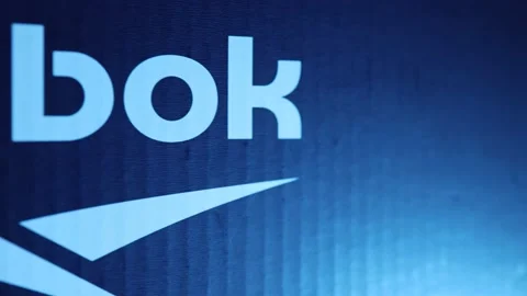 Reebok logo, on a blue background in neon light Stock Footage 147854602