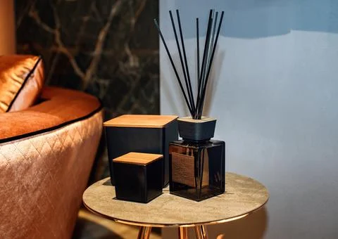 Reed diffuser and decorative boxes on the stylish table in contemporary style Foto stock
