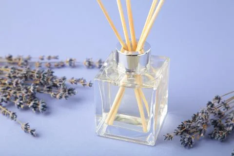 Reed diffuser and lavender on purple background Stock Photos