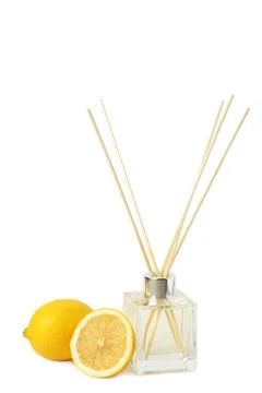 Reed diffuser and lemons isolated on white background Foto stock